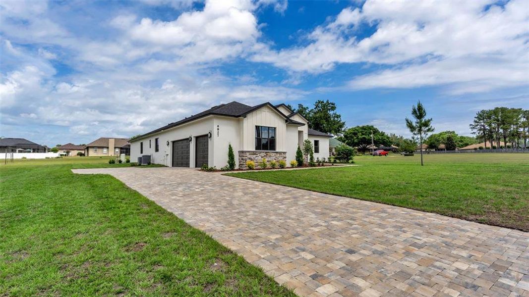 Front exterior of a new home in , Lakeland, FL, highlighting curb appeal (Image 28).