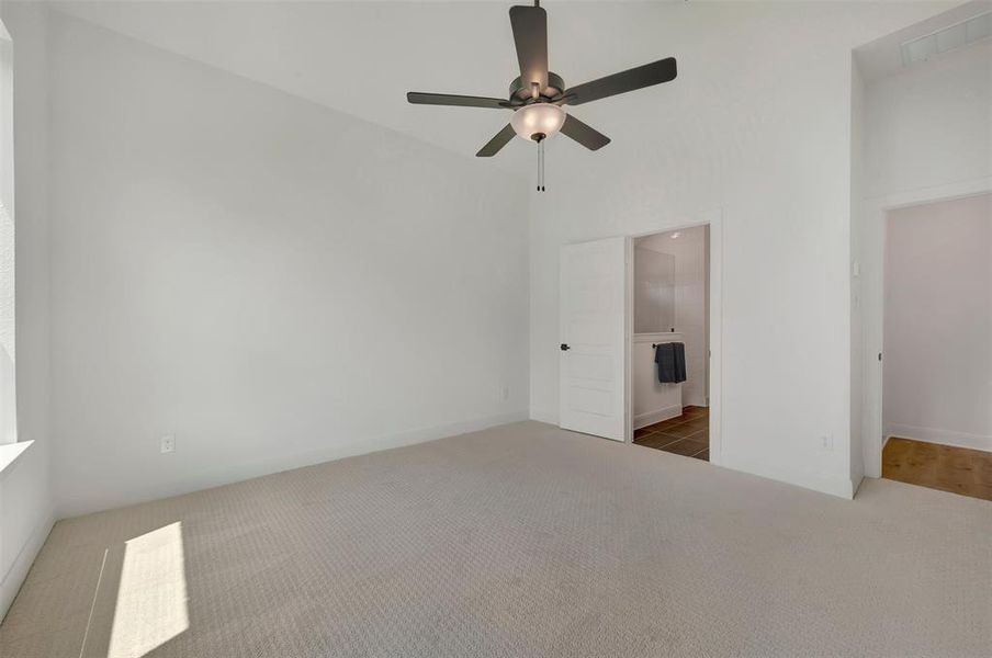 Vaulted ceilings featuring a ceiling fan with integrated lighting