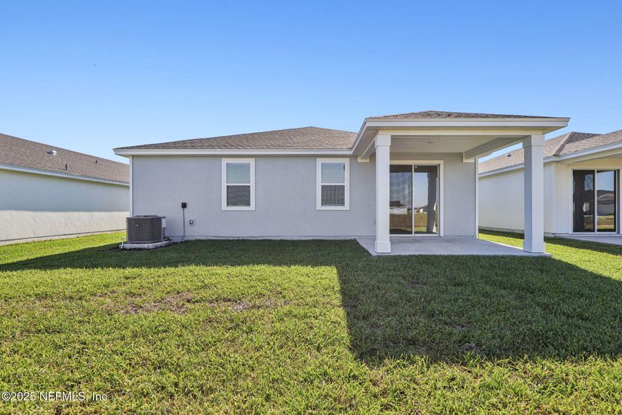 Exterior details and patio area of a home in Lakes at Bella Lago - Signature Series, Green Cove Springs (Image 23). Exterior details and patio area of a home in Lakes at Bella Lago - Signature Series, Green Cove Springs (Image 23).