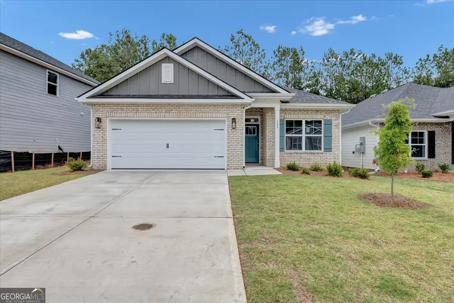 Front exterior of a new home in Canterbury Villas, Carrollton, GA, highlighting curb appeal (Image 2). Front exterior of a new home in Canterbury Villas, Carrollton, GA, highlighting curb appeal (Image 2).