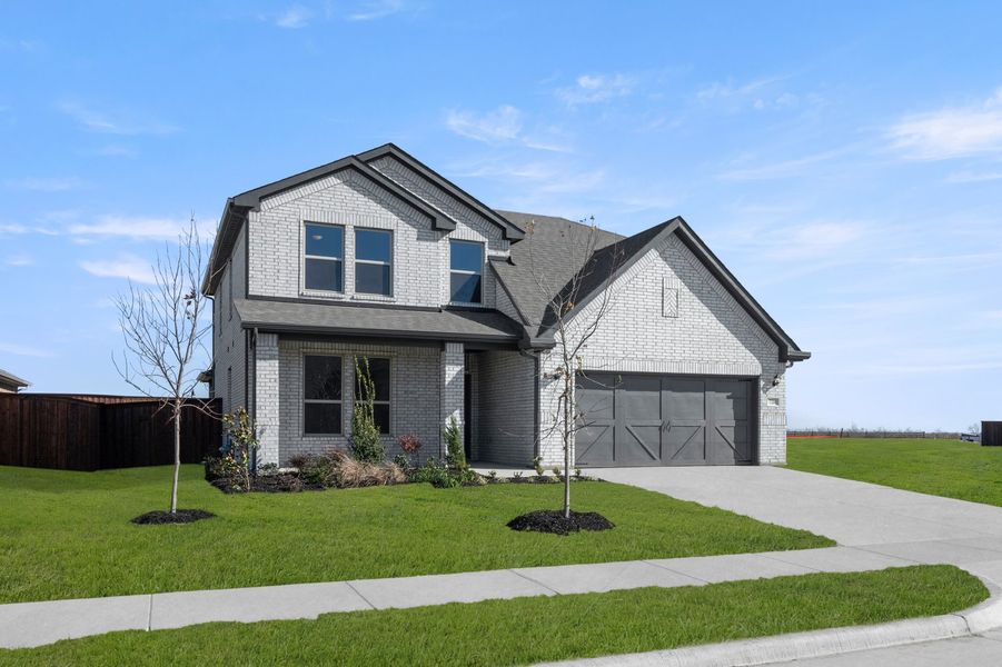 Front exterior of a new home in Myrtle Creek, Waxahachie, TX, highlighting curb appeal (Image 2). Front exterior of a new home in Myrtle Creek, Waxahachie, TX, highlighting curb appeal (Image 2).