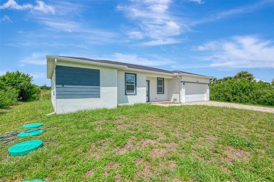 Front exterior of a new home in , Port Charlotte, FL, highlighting curb appeal (Image 18). Front exterior of a new home in , Port Charlotte, FL, highlighting curb appeal (Image 18).