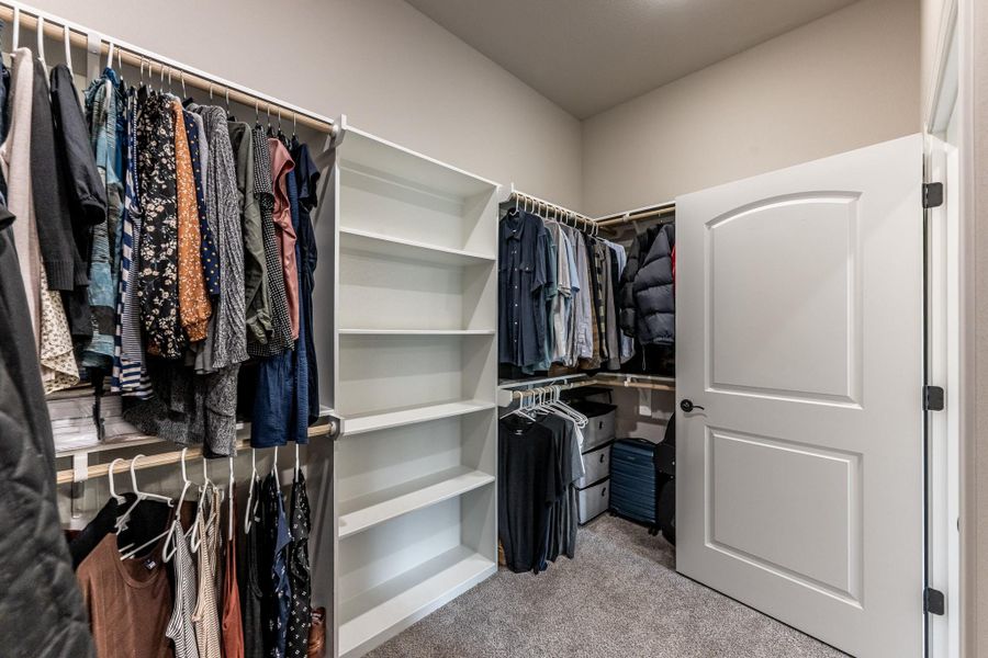 Walk in closet with extra area for desk