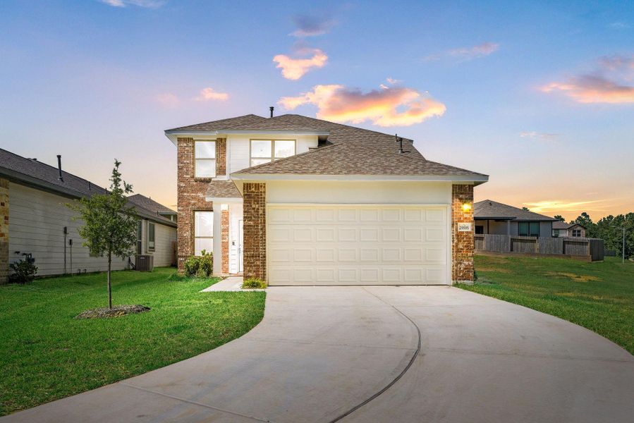 Front exterior of a new home in Magnolia Springs, Montgomery, TX, highlighting curb appeal (Image 27). Front exterior of a new home in Magnolia Springs, Montgomery, TX, highlighting curb appeal (Image 27).