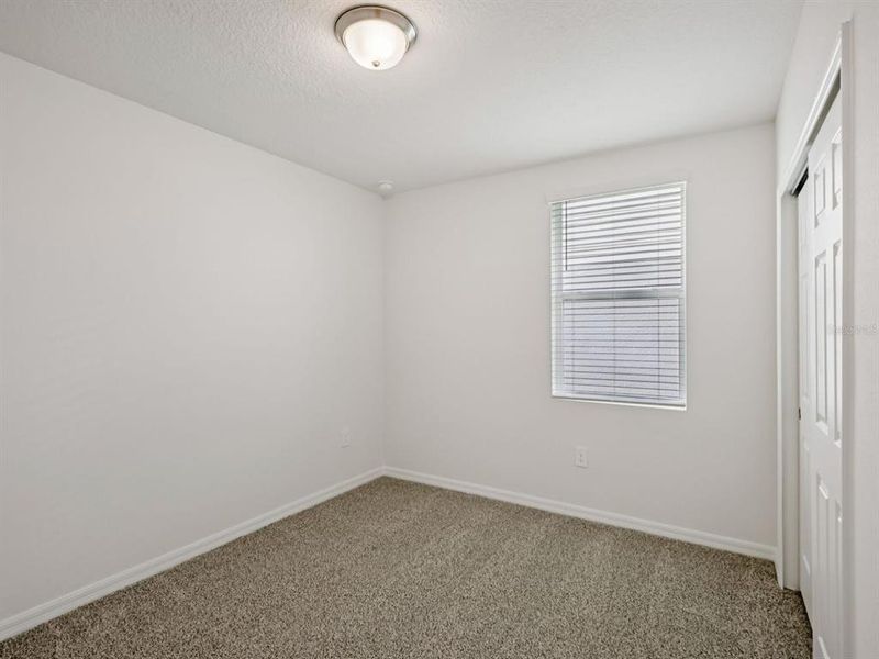 Spacious, unfurnished interior of a new home in Villamar - Signature Series, Winter Haven (Image 11).