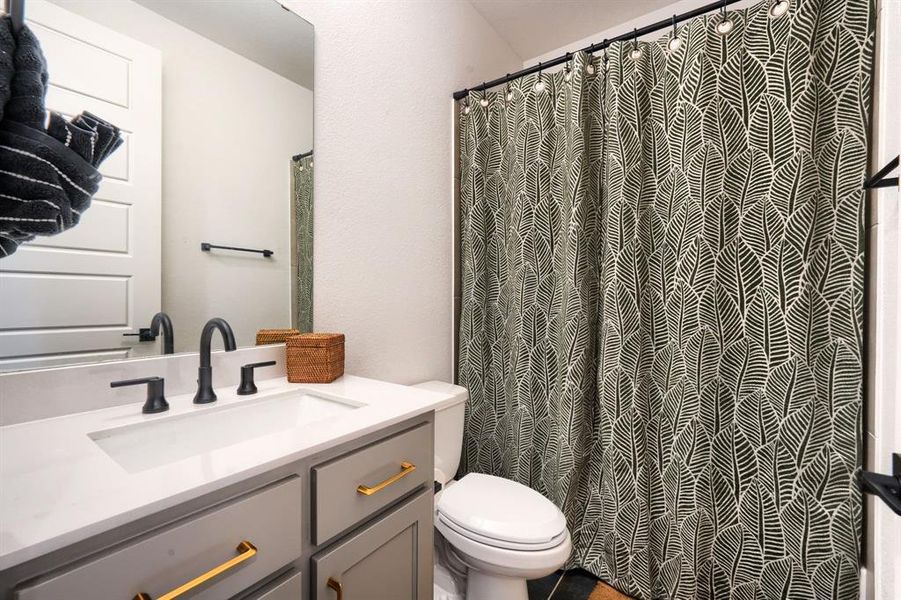 Bathroom with vanity and toilet