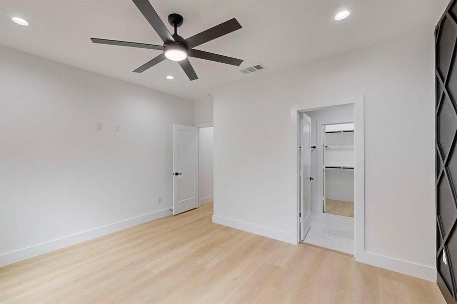 Unfurnished bedroom featuring light wood finished floors, recessed lighting, and ceiling fan Unfurnished bedroom featuring light wood finished floors, recessed lighting, and ceiling fan