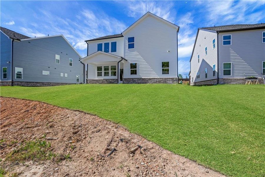 Exterior details and patio area of a home in The Paddocks at Doc Hughes, Buford (Image 2).