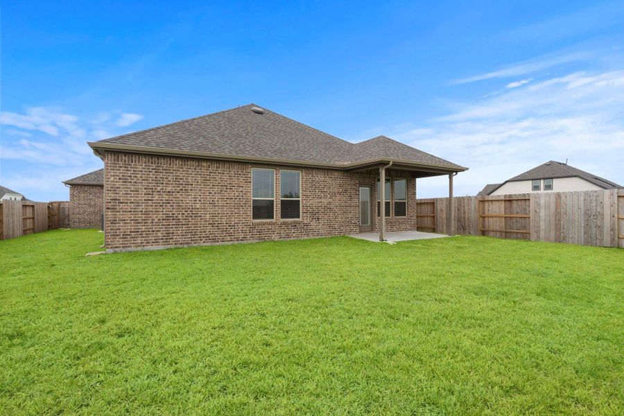 Front exterior of a new home in River Ranch, Dayton, TX, highlighting curb appeal (Image 14). Front exterior of a new home in River Ranch, Dayton, TX, highlighting curb appeal (Image 14).