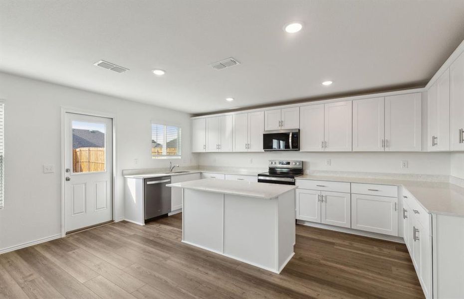 Bright kitchen with ample cabinet space *real home pictured