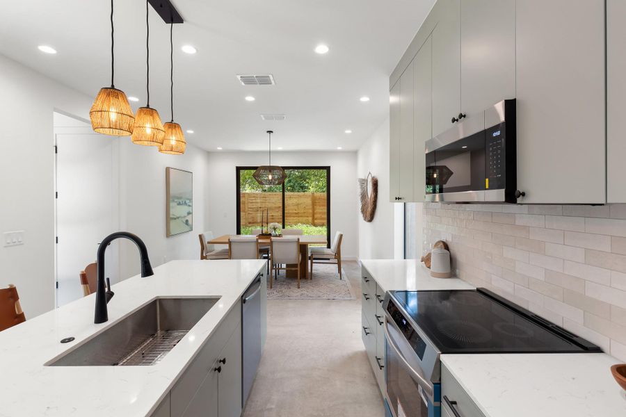 The kitchen’s spacious design contributes to the home’s surprisingly generous feel. The kitchen’s spacious design contributes to the home’s surprisingly generous feel.