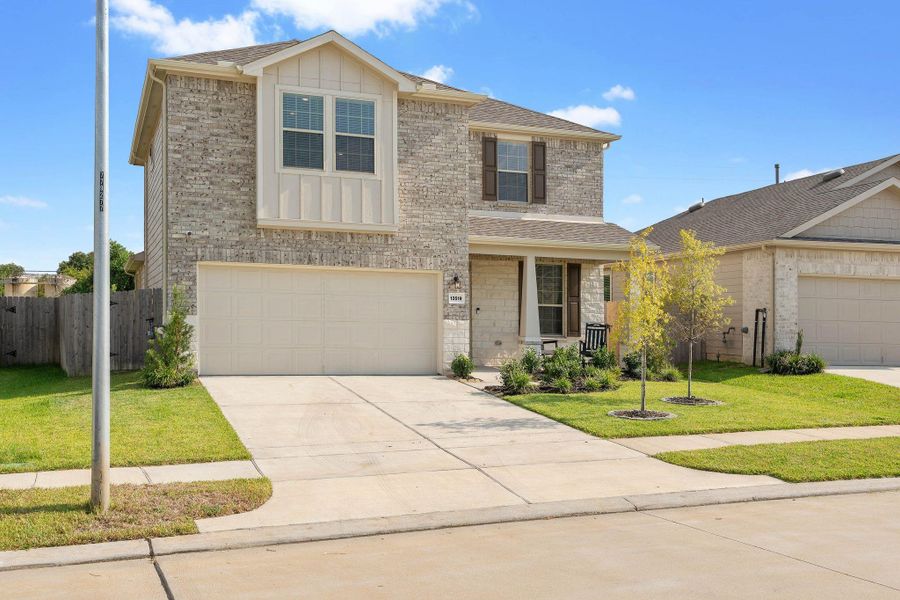Front exterior of a new home in Myrtle Gardens, Magnolia, TX, highlighting curb appeal (Image 21). Front exterior of a new home in Myrtle Gardens, Magnolia, TX, highlighting curb appeal (Image 21).