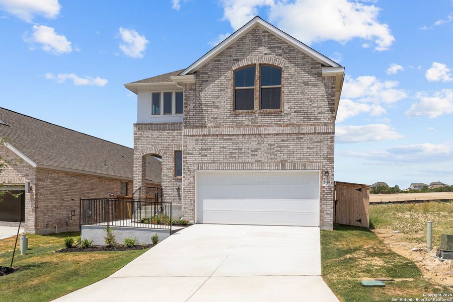 Front exterior of a new home in Ladera, San Antonio, TX, highlighting curb appeal (Image 17). Front exterior of a new home in Ladera, San Antonio, TX, highlighting curb appeal (Image 17).
