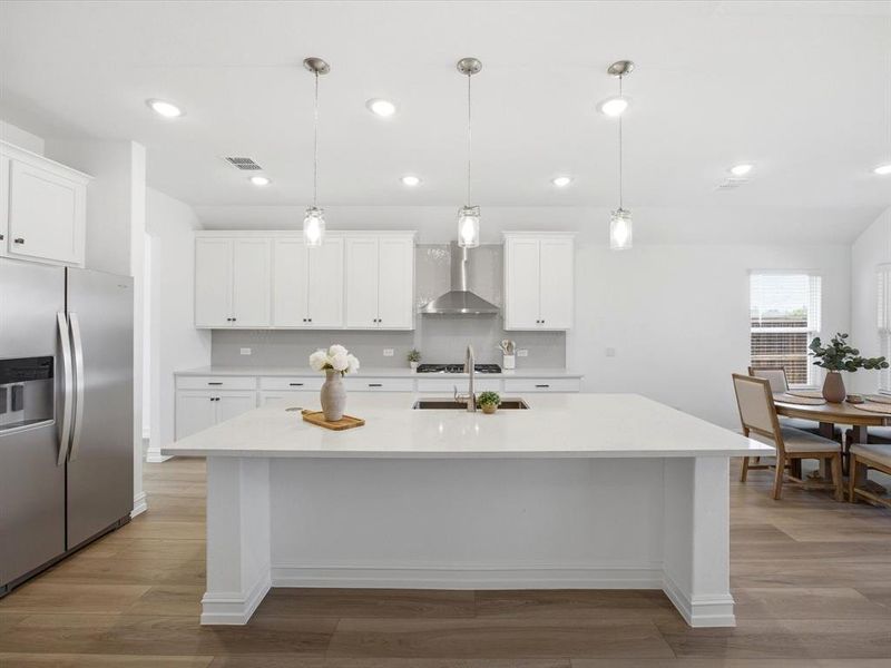 Kitchen view of single story three bedroom home with an office and a formal dining room