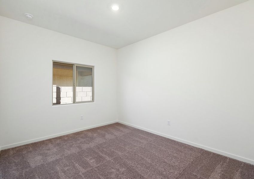 Secondary bedrooms have natural light creating a warm and inviting space.