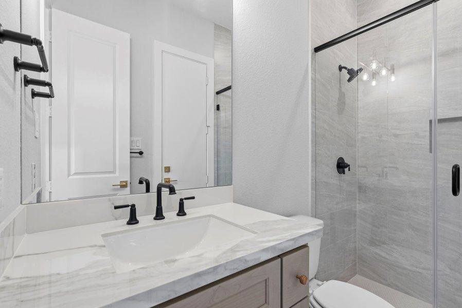 secondary bedroom ensuite bathroom with stand up shower