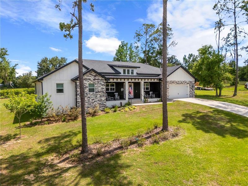 Front exterior of a new home in , Dade City, FL, highlighting curb appeal (Image 25).