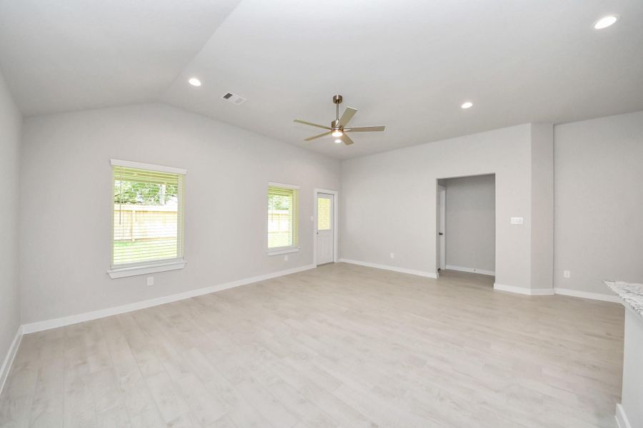 Take another glimpse into the heart of the home with this additional view of the family room—a sprawling space ready to accommodate all your gatherings. Sample photo of completed home with similar floor plan. Actual colors and selections may vary.