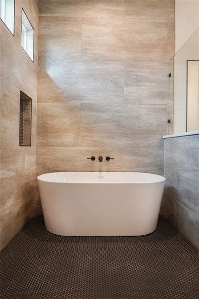 Bathroom featuring vanity, tile patterned floors, and an enclosed shower