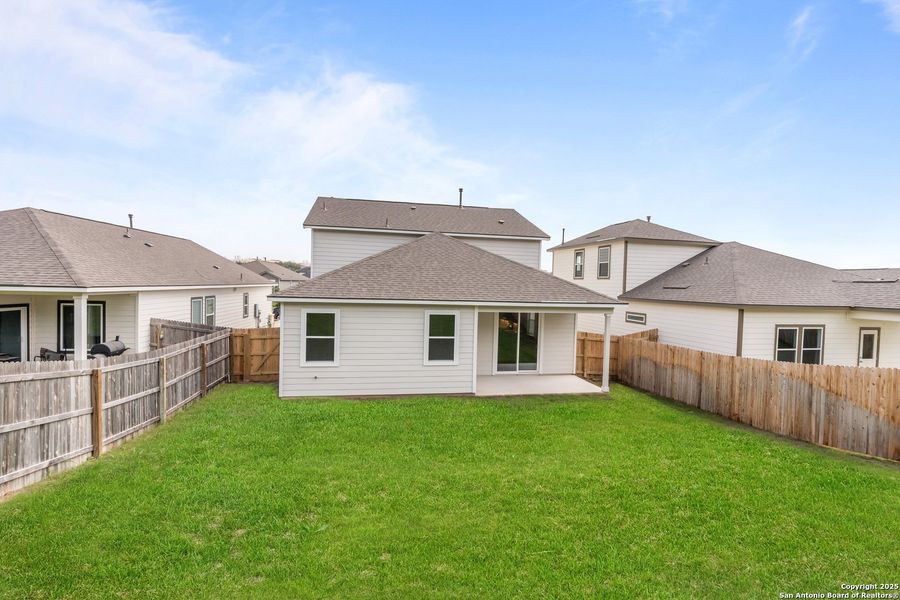 Front exterior of a new home in The Meadows at Hunters Ranch, San Antonio, TX, highlighting curb appeal (Image 17).