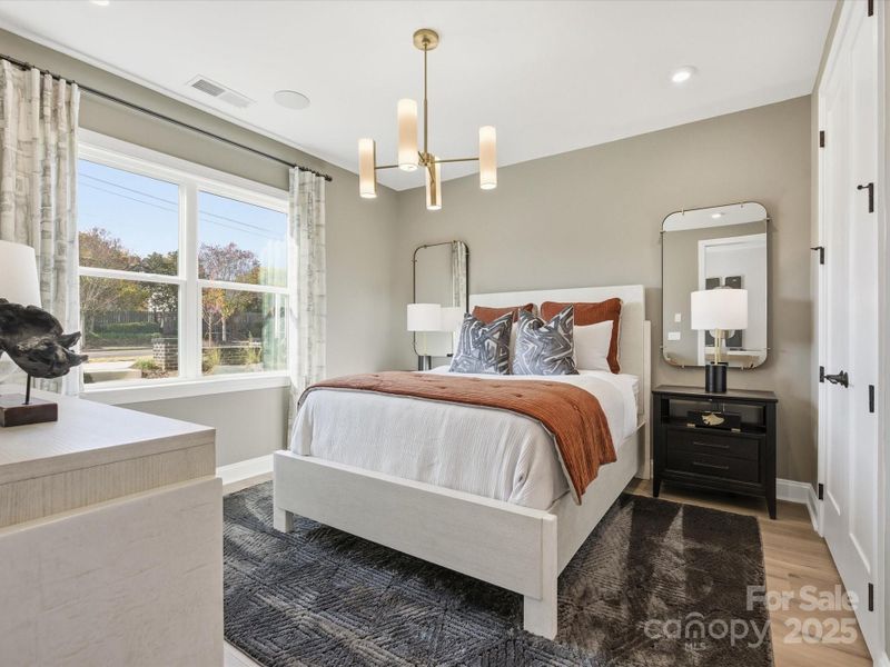 First Floor Guest Suite Filled with Natural Light. *Model Photos | Actual Finishes, Structural Selections, and Orientation May Vary.