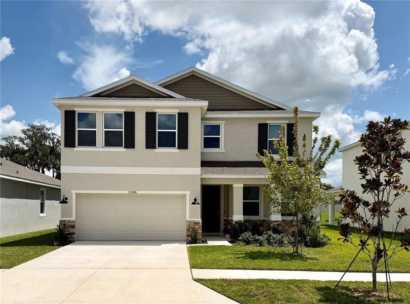 Front exterior of a new home in , San Antonio, FL, highlighting curb appeal (Image 2). Front exterior of a new home in , San Antonio, FL, highlighting curb appeal (Image 2).
