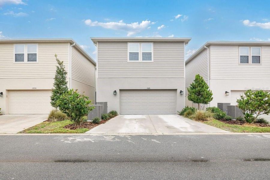 Front exterior of a new home in , Winter Garden, FL, highlighting curb appeal (Image 22).