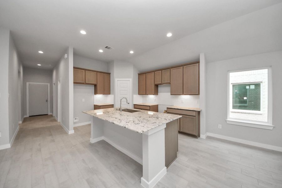 This kitchen is truly a chef's dream! Sample photo of completed home with similar floor plan. Actual colors and selections may vary.