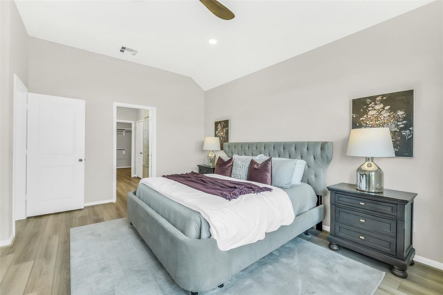 High ceilings and neutral tones enhance the airy feel of this suite, providing a calm and versatile backdrop for any decor style.