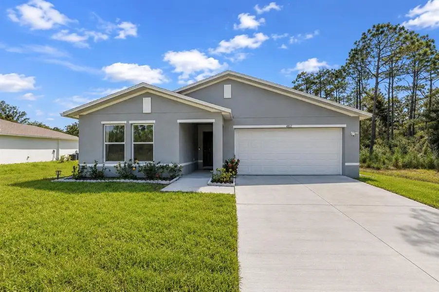 Front exterior of a new home in , North Port, FL, highlighting curb appeal (Image 22).