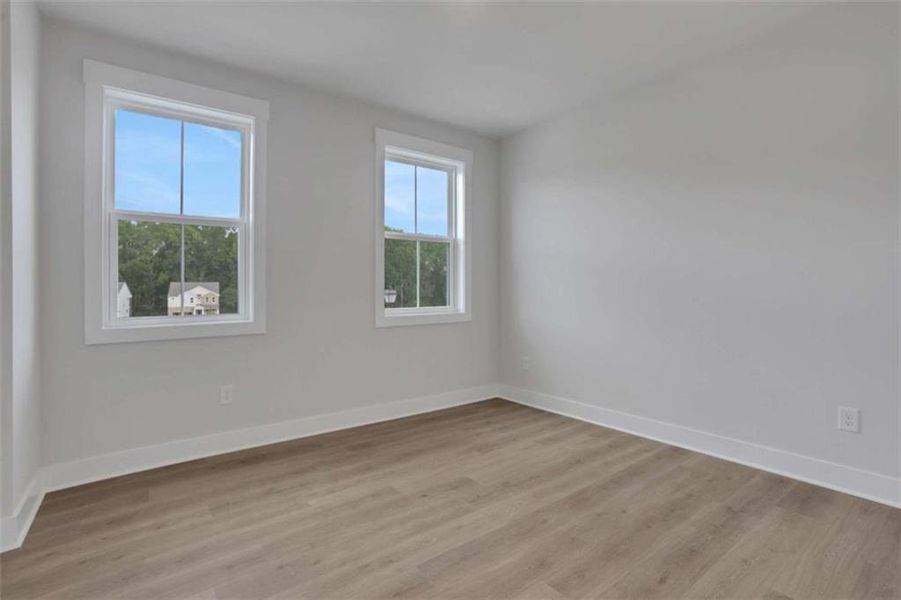 Spacious, unfurnished interior of a new home in The Paddocks at Doc Hughes, Buford (Image 33).