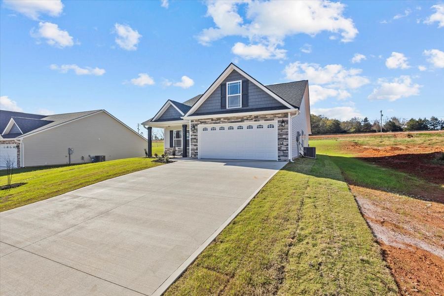 Representative exterior photo of a completed home built from the Morgan by Enchanted Homes in Lonesome Dove, San Antonio, TX (Image 21).