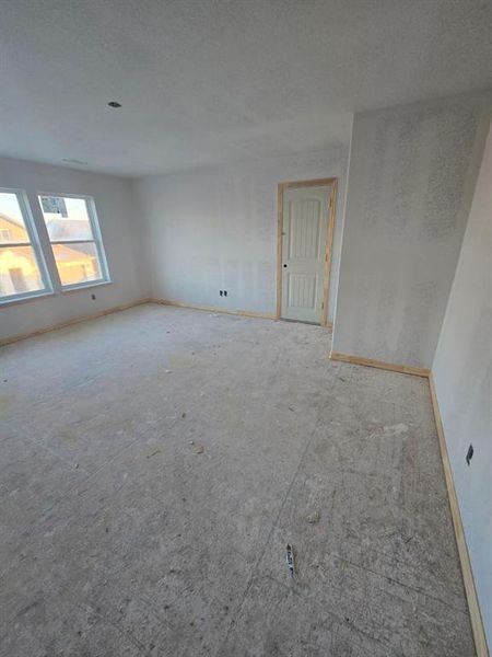 Unfurnished room featuring baseboards