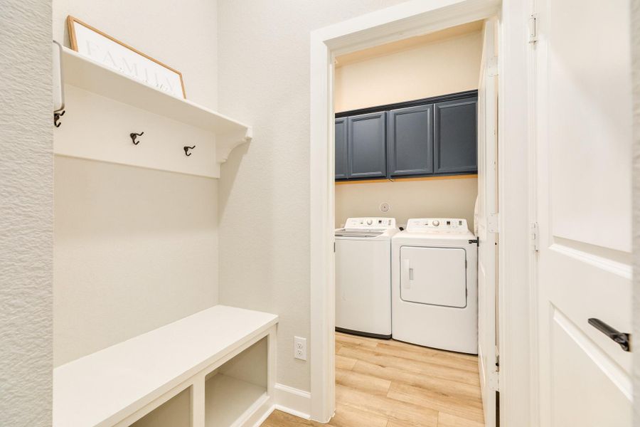 The mud room is a dedicated space for organizing and storing coats, boots, hats, and other outdoor gear. It is conveniently located at the entrance of the house with direct access to the garage