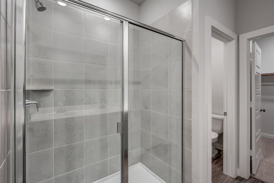 A shower with glass doors. A shower with glass doors.