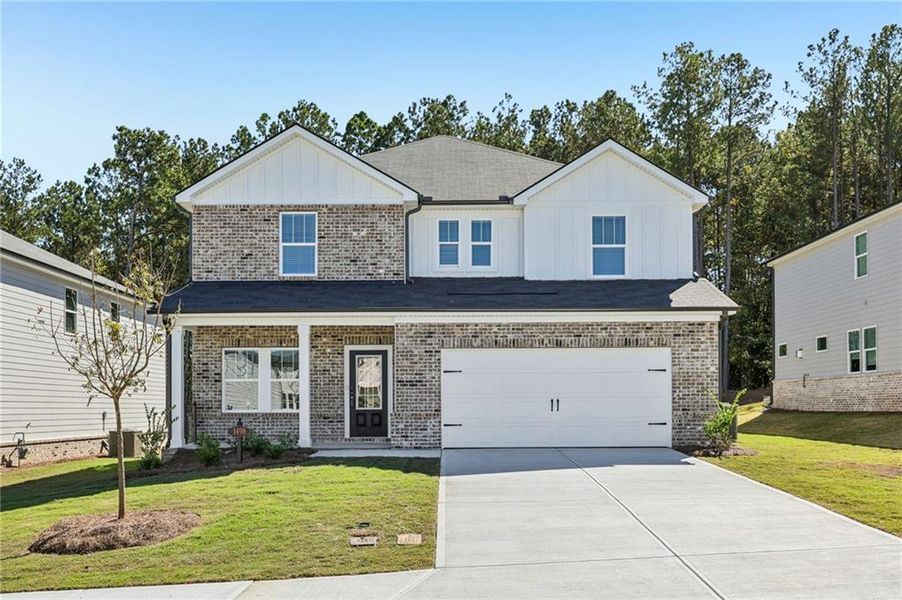 Front exterior of a new home in Parkside at Grayson, Grayson, GA, highlighting curb appeal (Image 1).