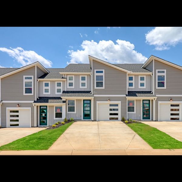 Front exterior of a new home in Westgate Village Townes, Spartanburg, SC, highlighting curb appeal (Image 1). Front exterior of a new home in Westgate Village Townes, Spartanburg, SC, highlighting curb appeal (Image 1).