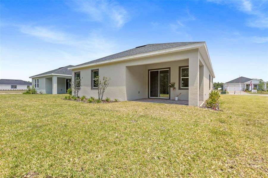 Exterior details and patio area of a home in Gray Hawk at Hole Two, Daytona Beach (Image 4).