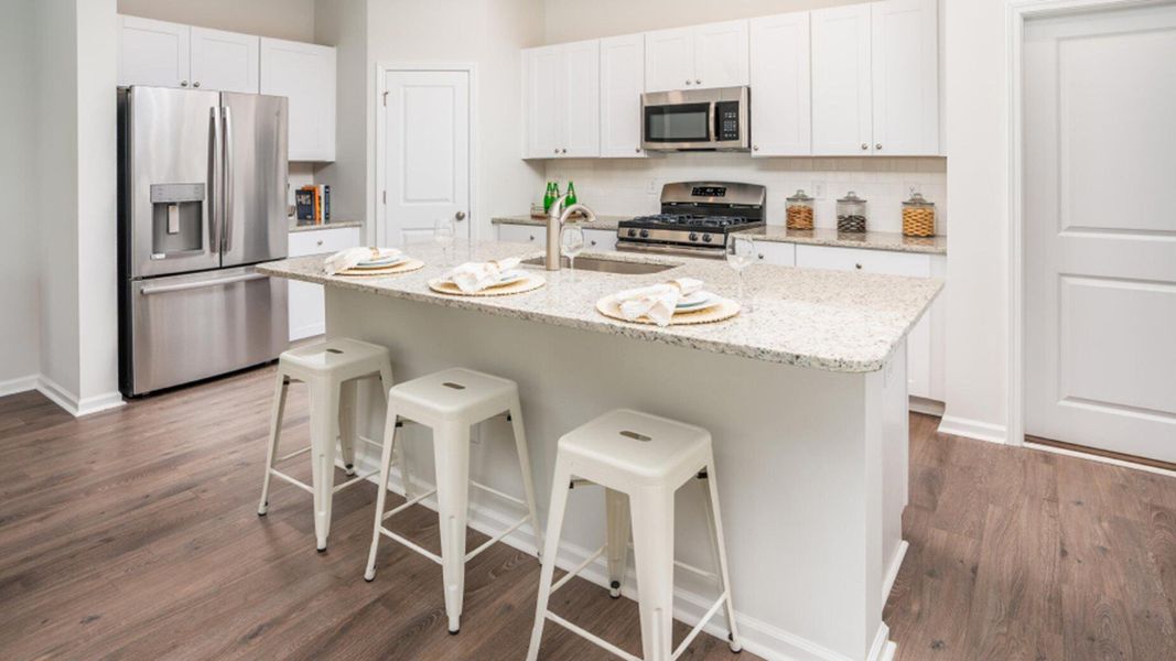 Furnished interior view inside a new home in Lindera Preserve at Cane Bay Plantation: American Dream Series, Summerville (Image 12). Furnished interior view inside a new home in Lindera Preserve at Cane Bay Plantation: American Dream Series, Summerville (Image 12).