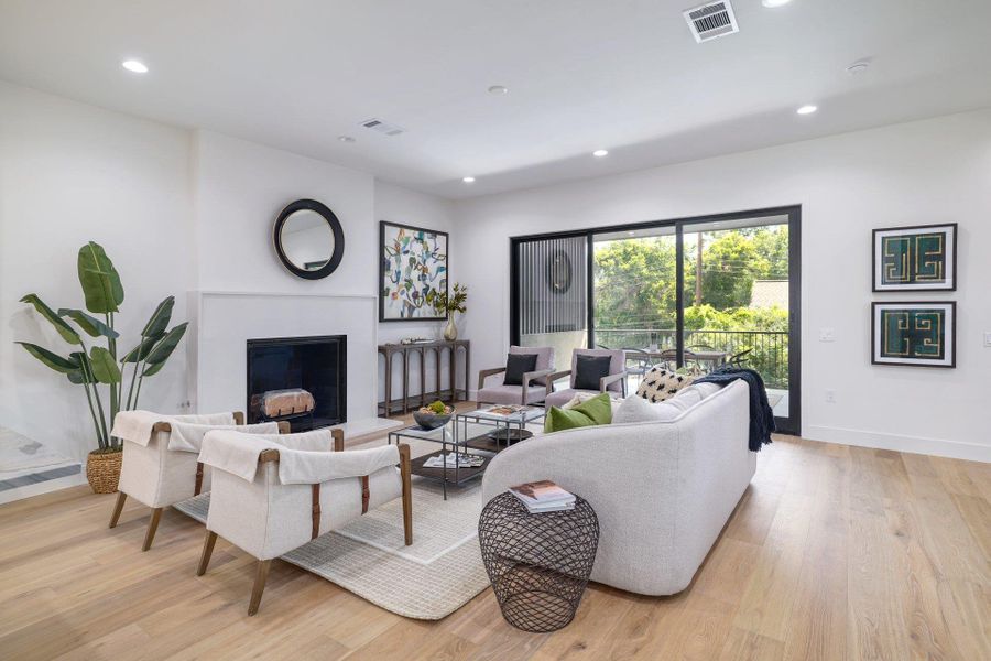 Light wood-finish flooring complements a neutral color palette