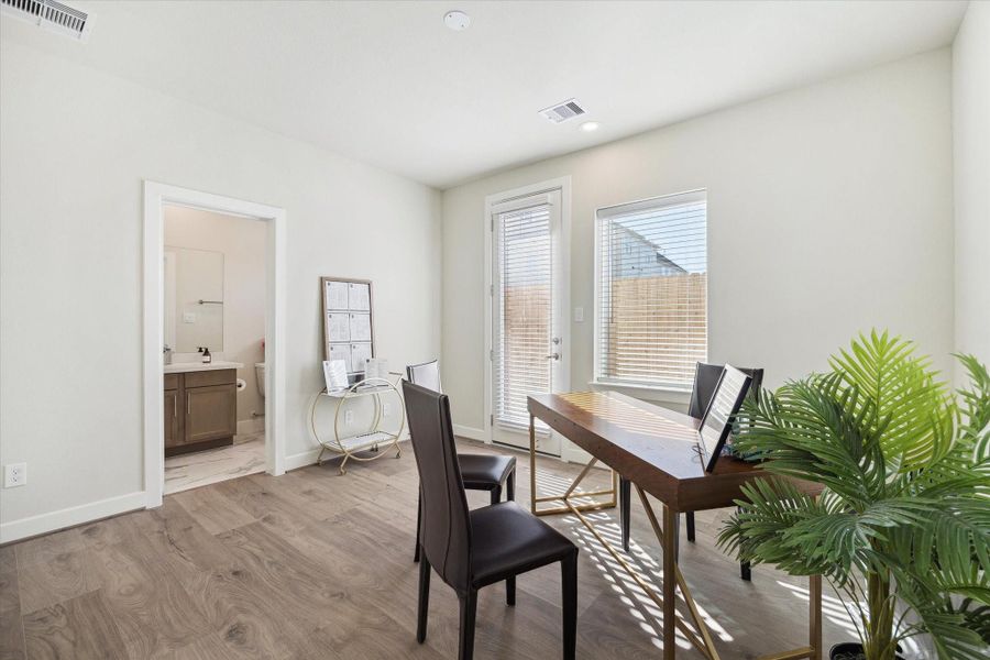 A bright first-floor bedroom or flex space offers the perfect setup for working from home or quiet study.