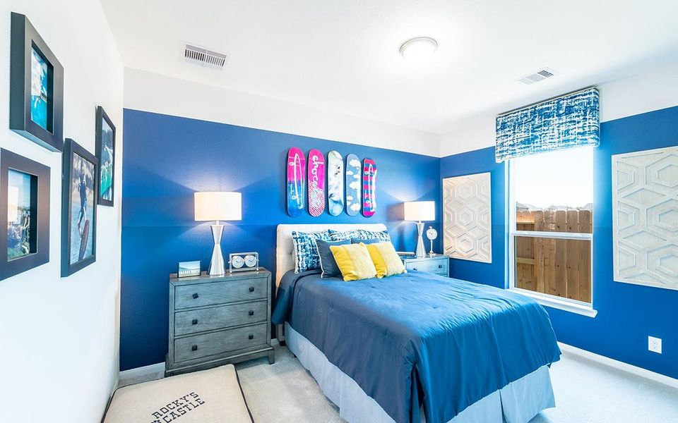 Carpeted bedroom with baseboards Carpeted bedroom with baseboards