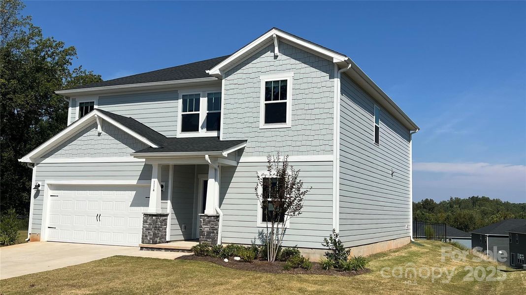 Front exterior of a new home in Sutter's Mill, Mooresville, NC, highlighting curb appeal (Image 1).