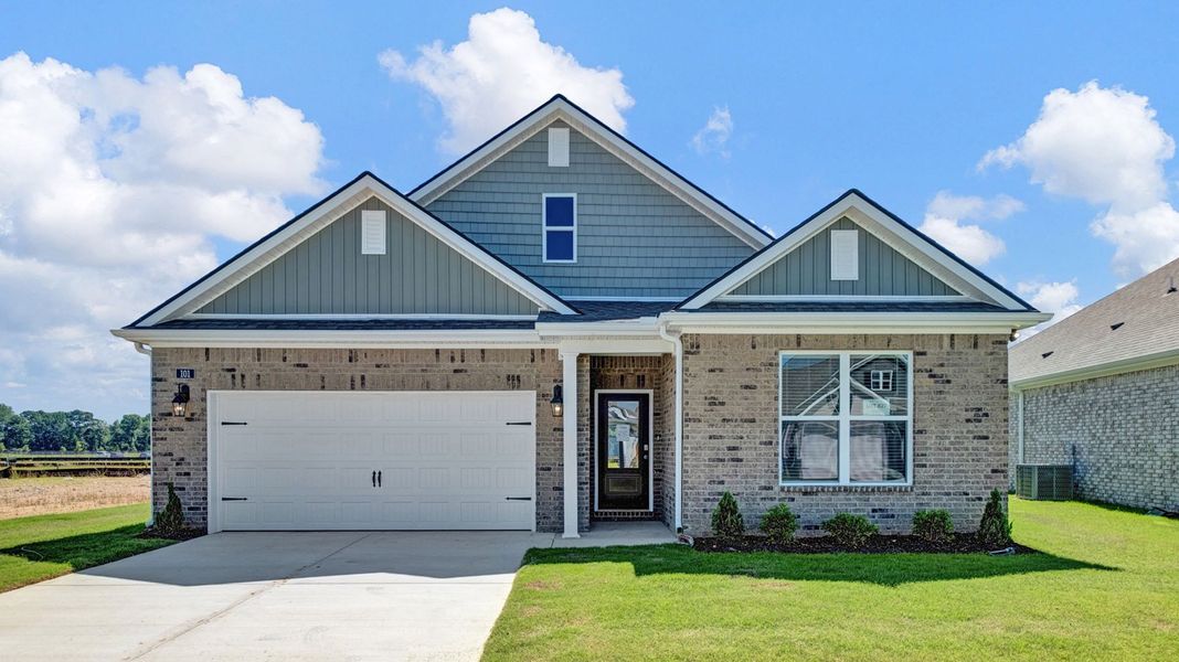 Front exterior of a new home in Shiloh Springs, Jackson, TN, highlighting curb appeal (Image 1). Front exterior of a new home in Shiloh Springs, Jackson, TN, highlighting curb appeal (Image 1).