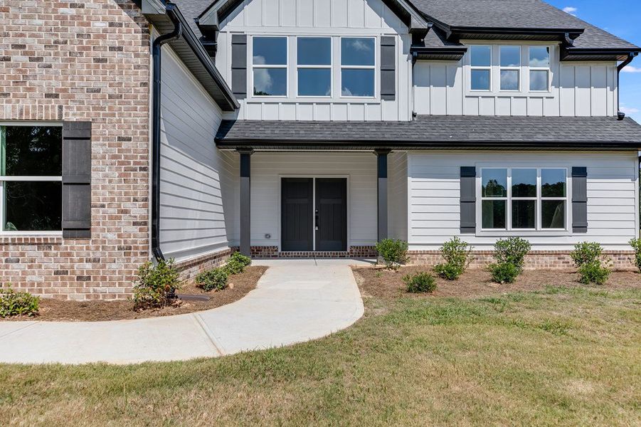 Front exterior of a new home in LOVVORN ESTATES, Carrollton, GA, highlighting curb appeal (Image 26).