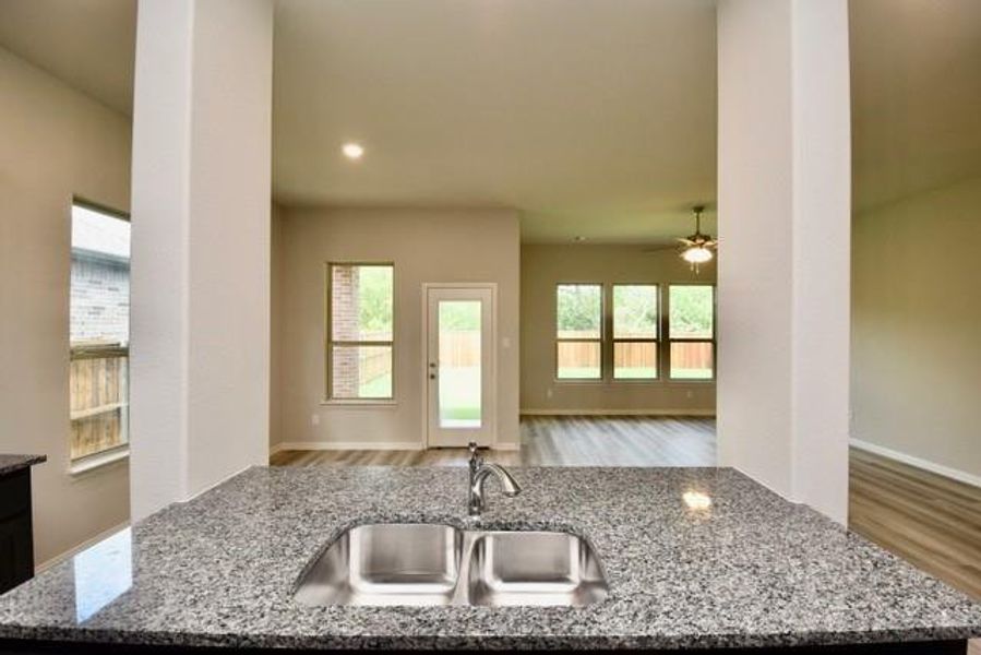 Kitchen with granite counters, and stainless undermount sink Kitchen with granite counters, and stainless undermount sink