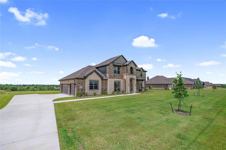 Front exterior of a new home in Eagle Ridge Estates, Weatherford, TX, highlighting curb appeal (Image 1). Front exterior of a new home in Eagle Ridge Estates, Weatherford, TX, highlighting curb appeal (Image 1).