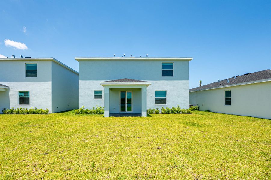 Front exterior of a new home in , Fort Pierce, FL, highlighting curb appeal (Image 15).