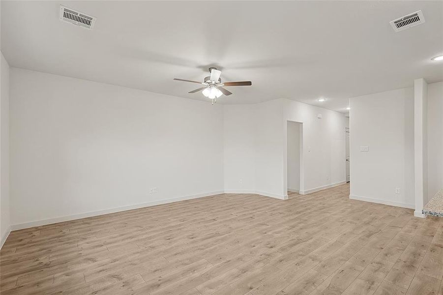 Unfurnished room featuring light hardwood / wood-style floors and ceiling fan