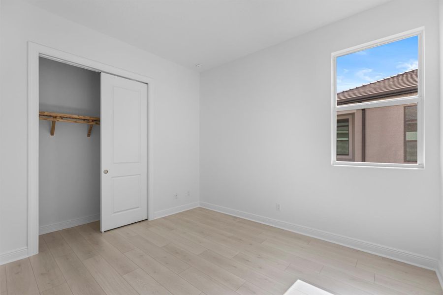 Furnished interior view inside a new home in PGA Village Verano, Port St. Lucie (Image 19).